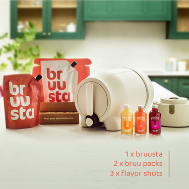Complete kombucha home brewing kit on kitchen counter including the Bruusta brewing device for making kombucha easily at home