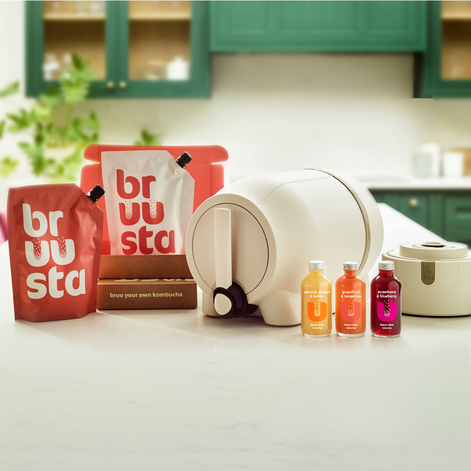 Complete kombucha home brewing kit on kitchen counter including the Bruusta brewing device for making kombucha easily at home